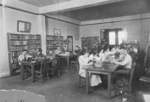 people reading quietly in a public library