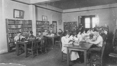 people reading quietly in a public library