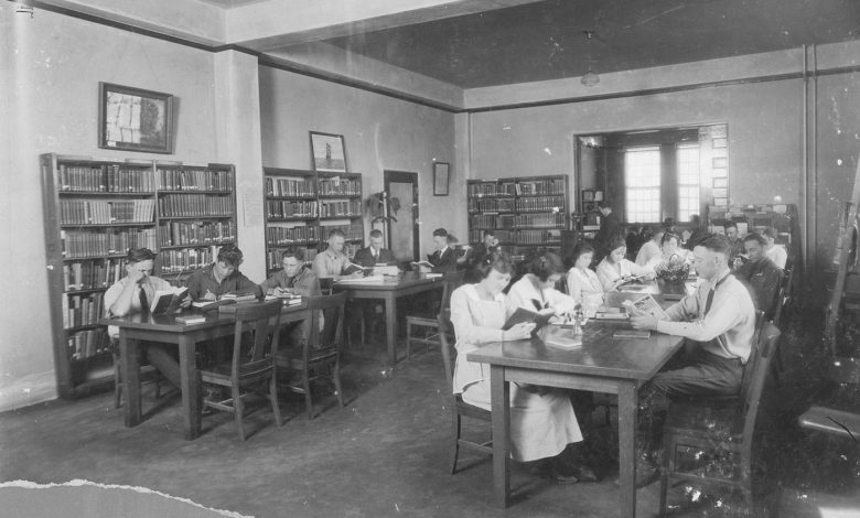 people reading quietly in a public library
